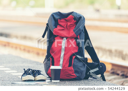 Backpack traveler for adventure trips at the train Backpack traveler for adventure trips at the train 54244129