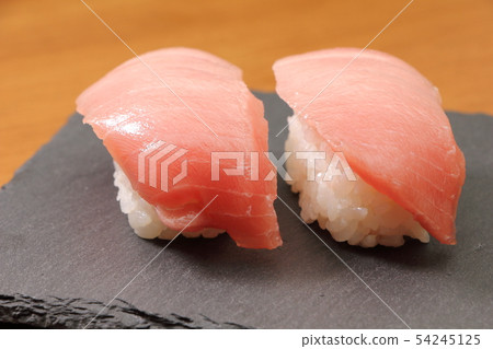 Tuna Naka Toro Nigiri Sushi (on slate plate, 2 holes) Tuna Naka Toro Nigiri Sushi (on slate plate, 2 holes) 54245125