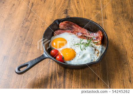 Skillet sliced thick bacon egg Bacon and eggs and iron fry pan 54245262