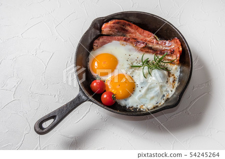 Skillet sliced thick bacon egg Bacon and eggs and iron fry pan 54245264