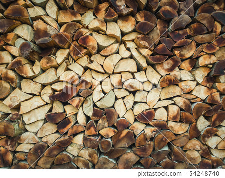 Closeup pattern of a stack of split logs, old 54248740
