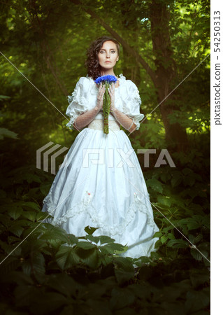Fantastic girl in a white dress with flowers Fantastic girl in a white dress with flowers 54250313