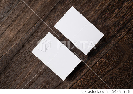 top view of white business card on wood floor top view of white business card on wood floor 54251566