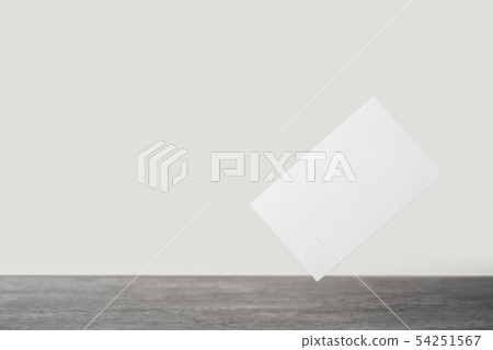 front view of white business card on stone floor front view of white business card on stone floor 54251567
