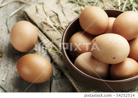 Brown eggs in a plate. Brown eggs in a plate. 54252514