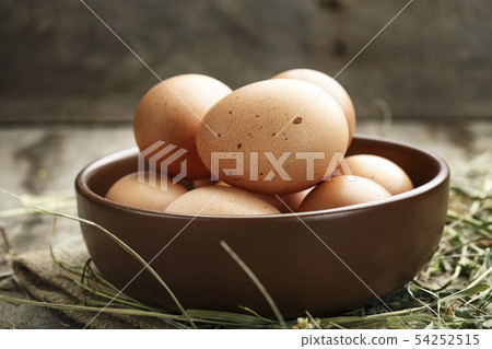 Brown eggs in a plate. Brown eggs in a plate. 54252515