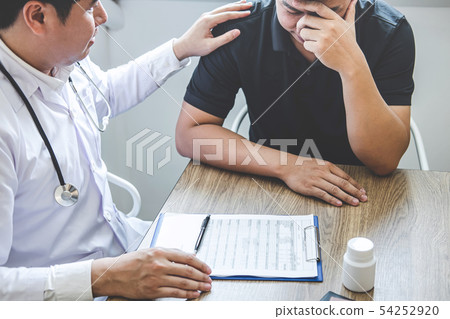 Image of doctor holding patient's hand to 54252920