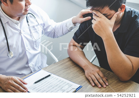 Image of doctor holding patient's hand to 54252921