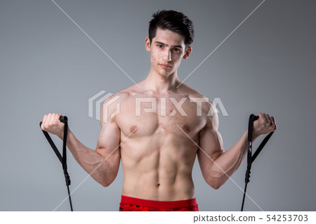Studio portrait young Caucasian man on gray background posing. theme of puberty, problem skin, teen Studio portrait young Caucasian man on gray background posing. theme of puberty, problem skin, teen 54253703