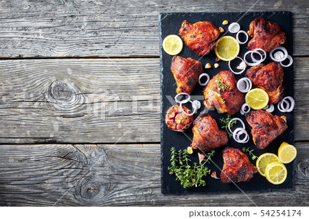 fried chicken thighs on a slate plate fried chicken thighs on a slate plate 54254174