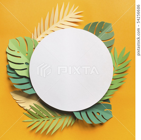 Tropical leaves composition around white blank place on yellow Tropical leaves composition around white blank place on yellow 54256686