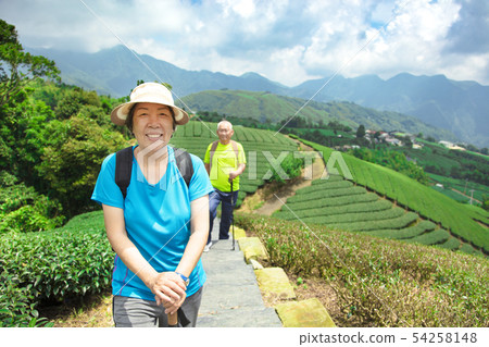 happy asian senior couple hiking in the nature happy asian senior couple hiking in the nature 54258148