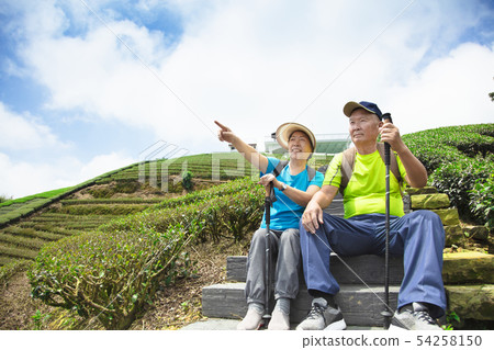 happy asian senior couple hiking in the nature happy asian senior couple hiking in the nature 54258150