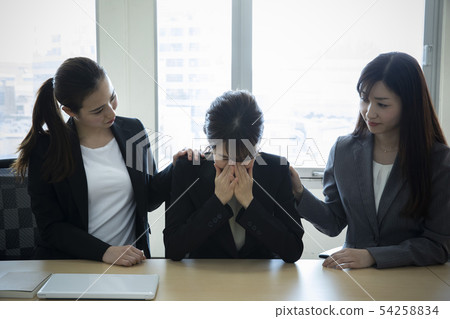 Crying ol and comforting colleague Crying ol and comforting colleague 54258834