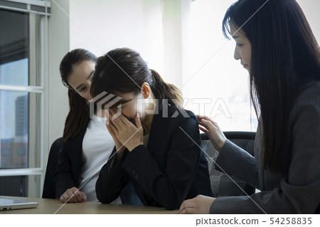 Crying ol and comforting colleague 54258835