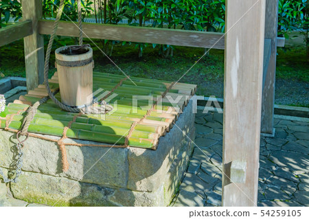 A well with a bamboo lid A well with a bamboo lid 54259105