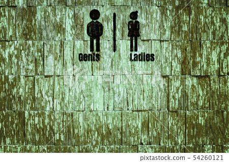 Toilet sign on wood texture background. Toilet sign on wood texture background. 54260121