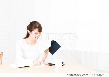 A young woman studying A young woman studying 54260259