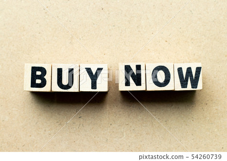 Letter block in word buy now on wood background 54260739