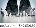 Business man holding stack of coins 54263989