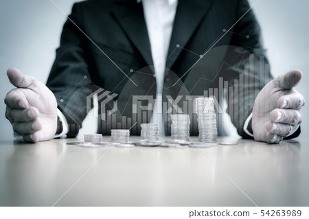 Business man holding stack of coins Business man holding stack of coins 54263989