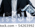 Business man putting coin on pile of money 54263992