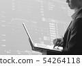Business man using laptop in stock market 54264118