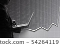 Business man using laptop in stock market 54264119