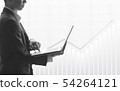 Business man using laptop in stock market 54264121