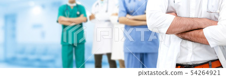 Doctor working in hospital with other doctors. Doctor working in hospital with other doctors. 54264921