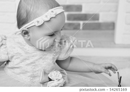 child with bandage with flowers on head close-up child with bandage with flowers on head close-up 54265169