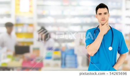 Male pharmacist working at the pharmacy. Male pharmacist working at the pharmacy. 54265696