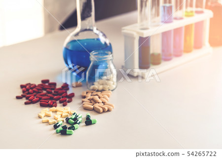 Medicine pills and tablets in research lab. Medicine pills and tablets in research lab. 54265722