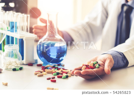 Medicine pills and tablets in research lab. Medicine pills and tablets in research lab. 54265823