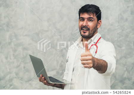 Doctor using laptop computer at the hospital. 54265824