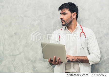 Doctor using laptop computer at the hospital. Doctor using laptop computer at the hospital. 54265977