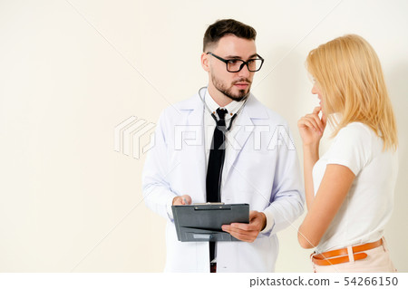 Male Doctor and Female Patient in Hospital Office Male Doctor and Female Patient in Hospital Office 54266150