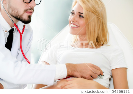 Male Doctor and Female Patient in Hospital Office Male Doctor and Female Patient in Hospital Office 54266151