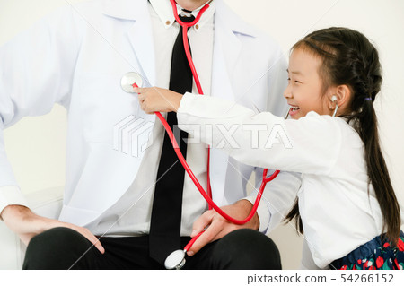 Happy little kid visit doctor in hospital office. 54266152
