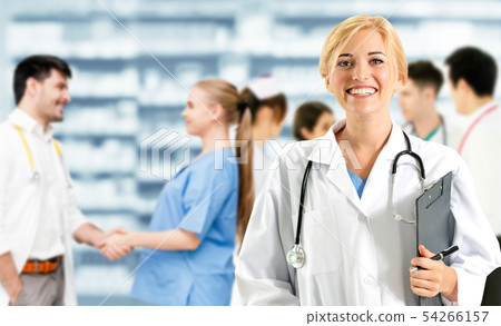 Doctor working in hospital with other doctors. Doctor working in hospital with other doctors. 54266157