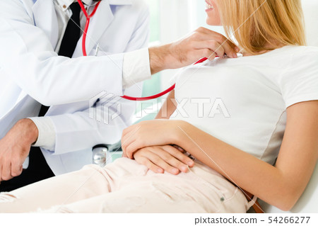 Male Doctor and Female Patient in Hospital Office Male Doctor and Female Patient in Hospital Office 54266277