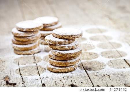 Fresh oat cookies with sugar powder on rustic 54271462