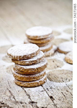 Fresh oat cookies with sugar powder on rustic 54271465