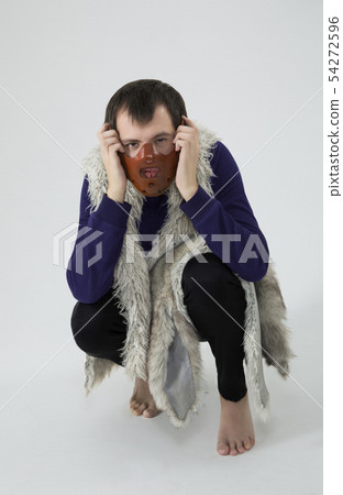 a man in a mask on his face. in vest, with fur 54272596