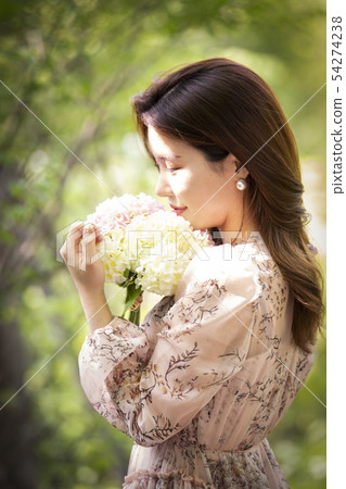 Woman with flowers 54274238