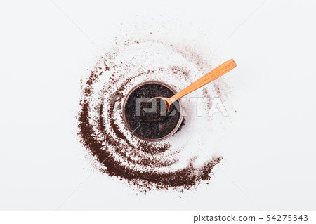 Coffee body scrub in jar with wooden spoon 54275343