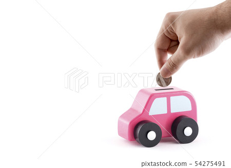 Putting coin into the car coin bank on white 54275491