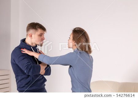 people, abuse and violence concept - agressive man strangling his wife people, abuse and violence concept - agressive man strangling his wife 54276614