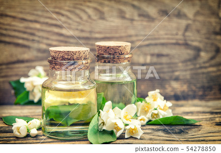 Massage oil fresh jasmine flowers vintage toned Massage oil fresh jasmine flowers vintage toned 54278850