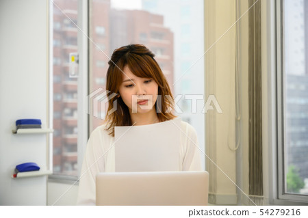 Young woman checking documents 54279216
